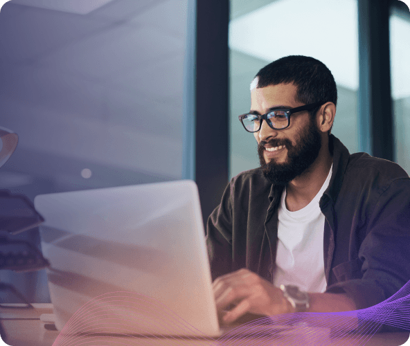 man smiling working laptop