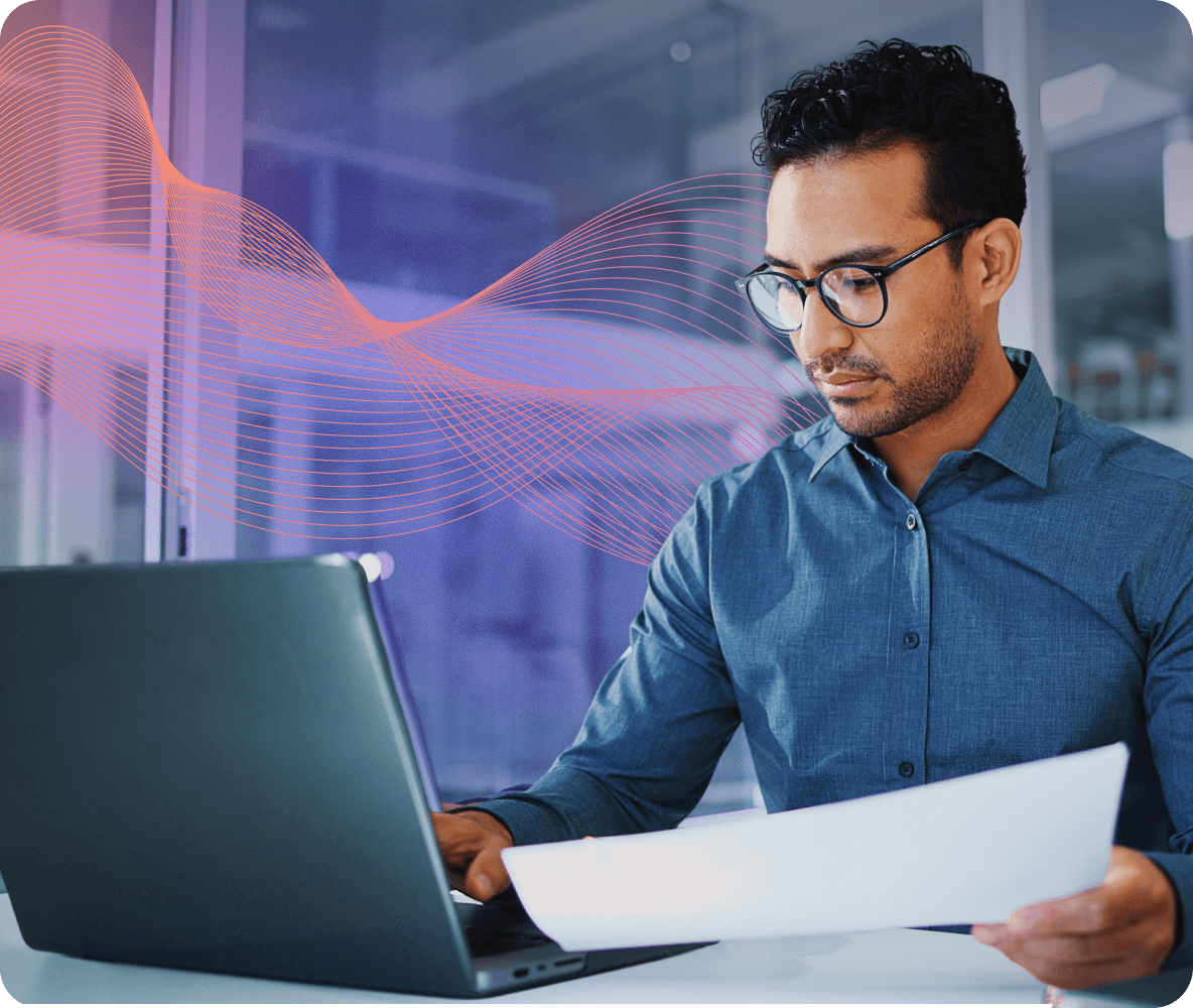 professional man reviewing documents laptop