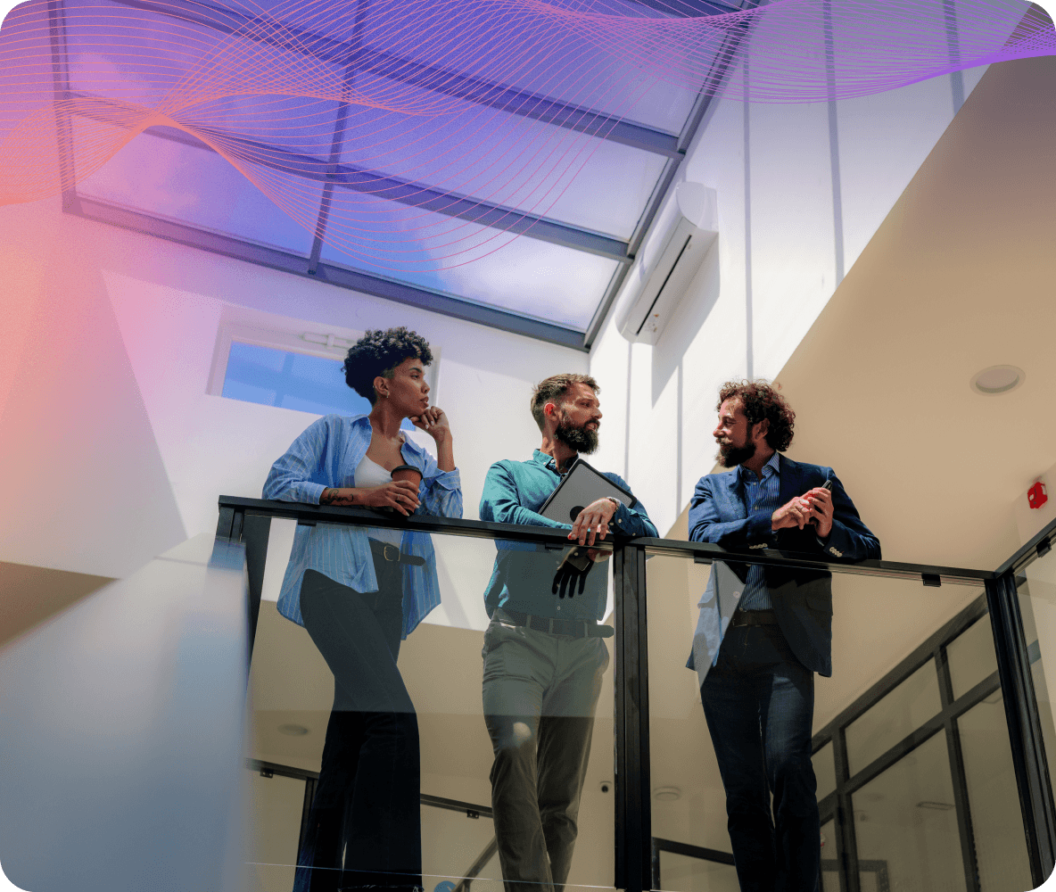 three colleagues talking office
