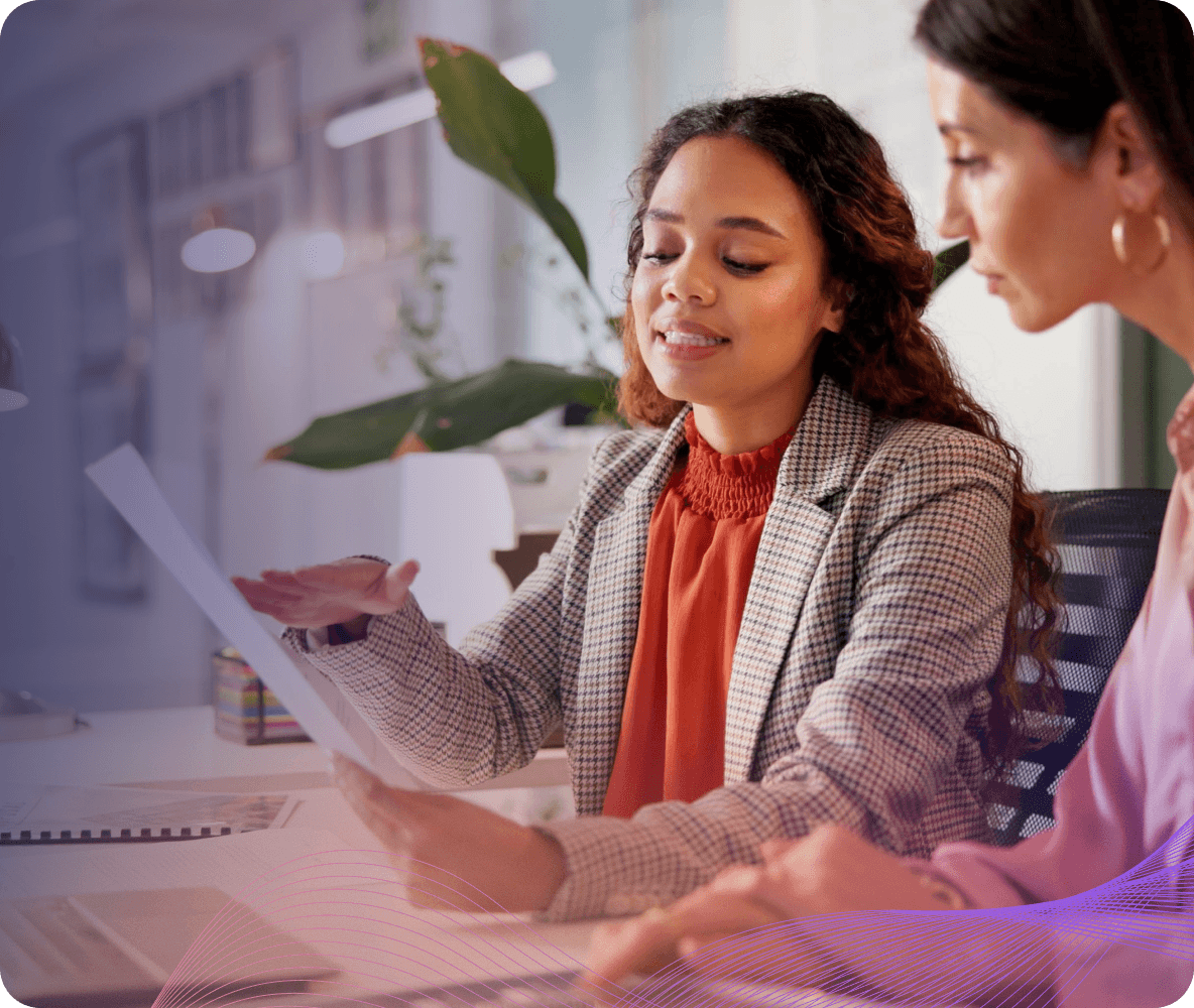 two women reviewing document